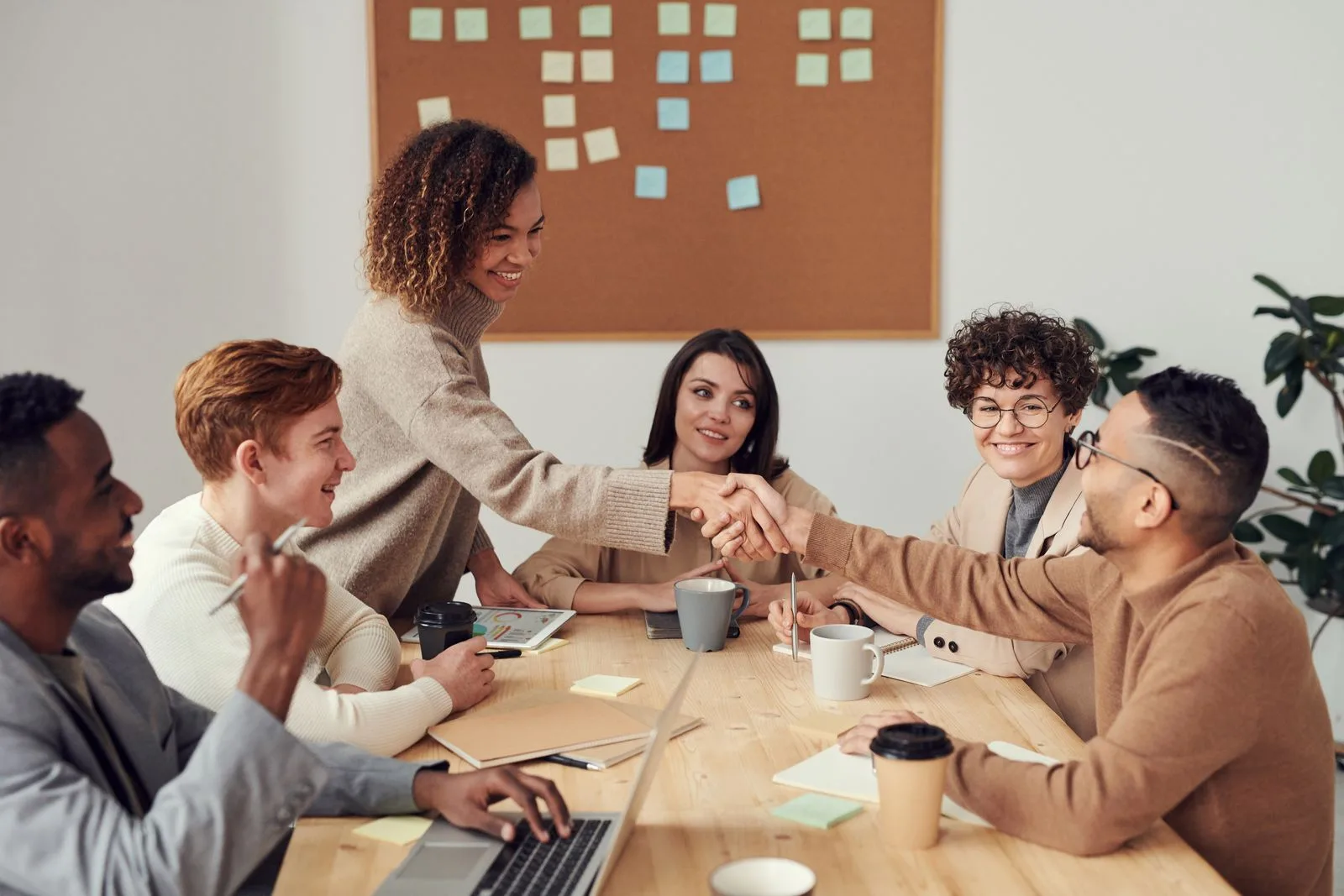 An agency team reviewing work together at a shared table